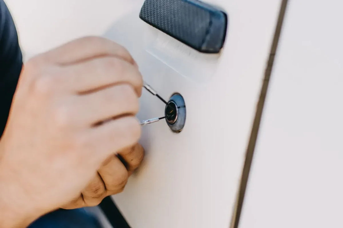 Thief trying to pick car lock