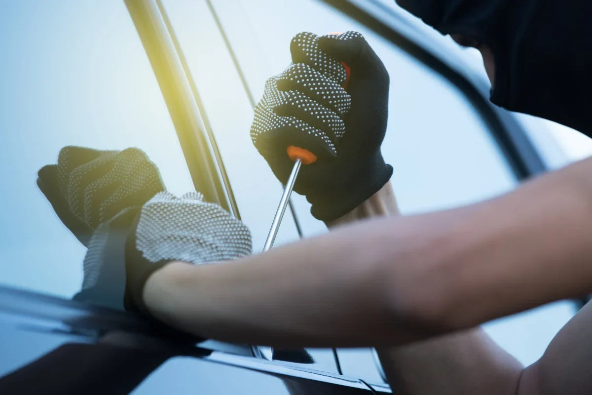 Close up of someone trying to break into a car