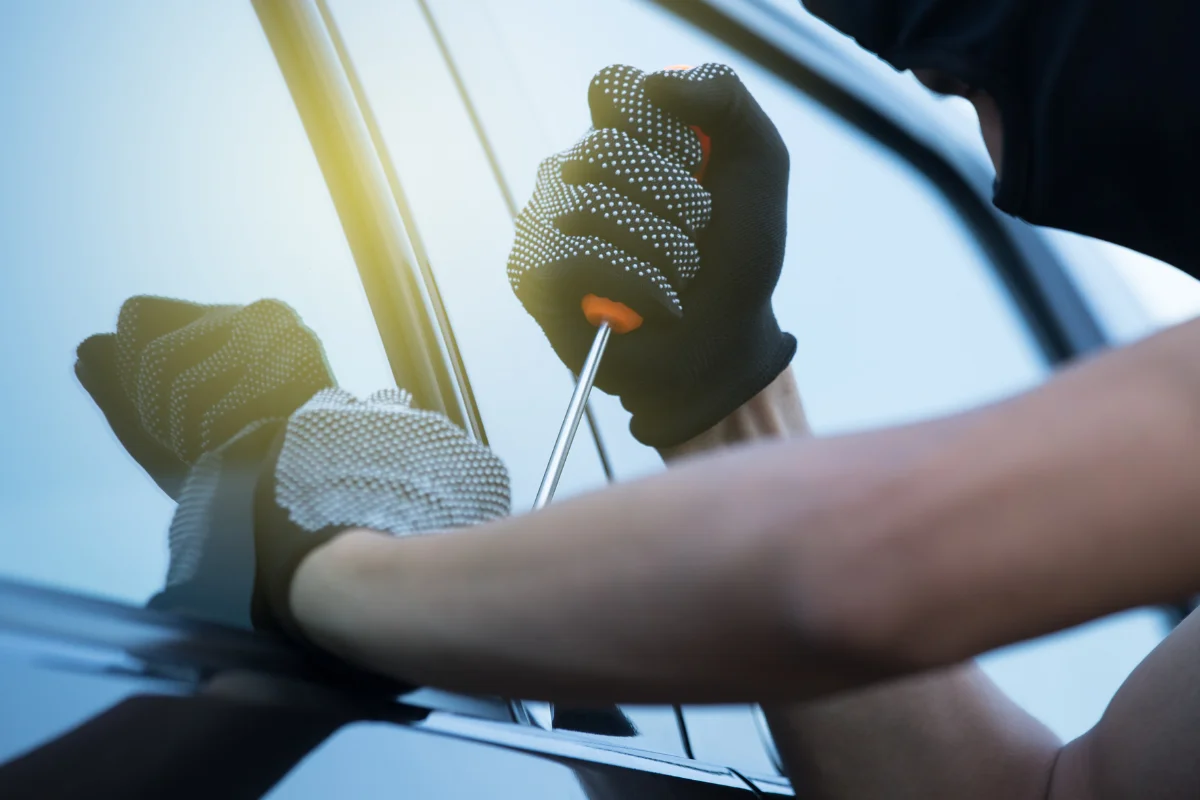 Close up of someone trying to break into a car